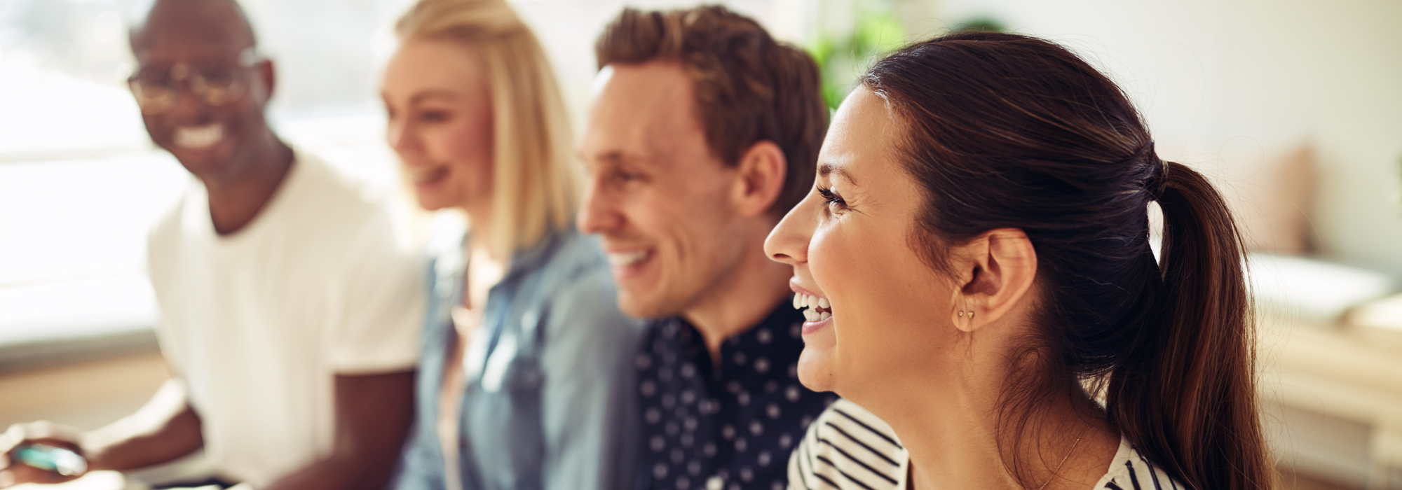 people smiling and talking together 