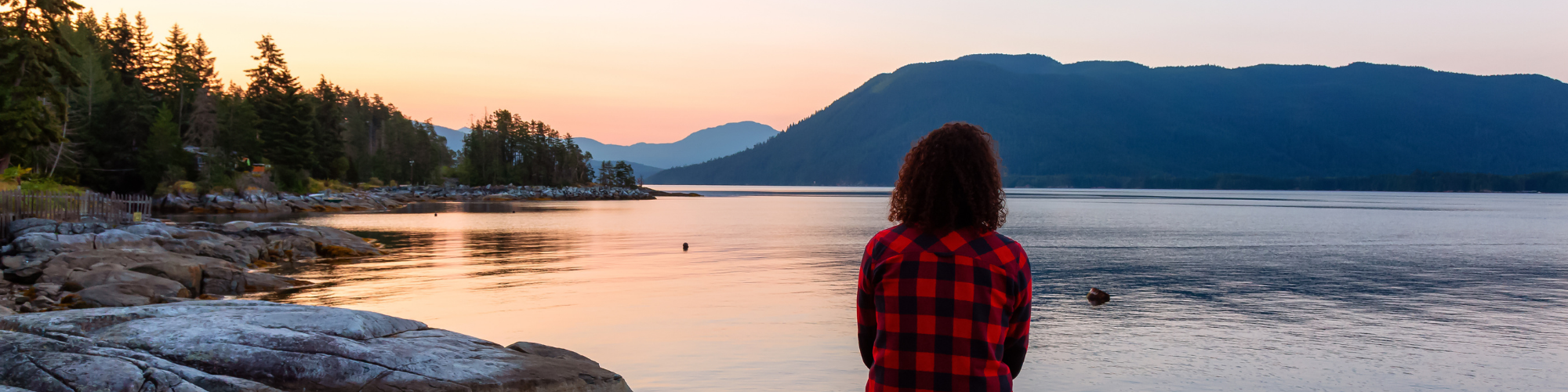 girl overlooking lake and mountains 